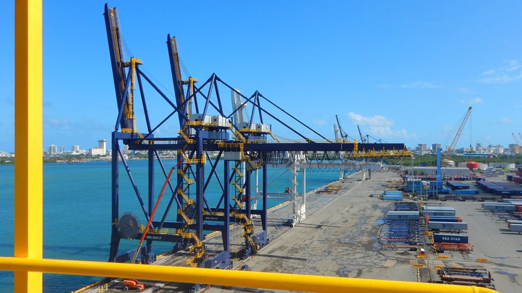 Container cranes at Puerto Rico terminal for cargo loading and unloading.